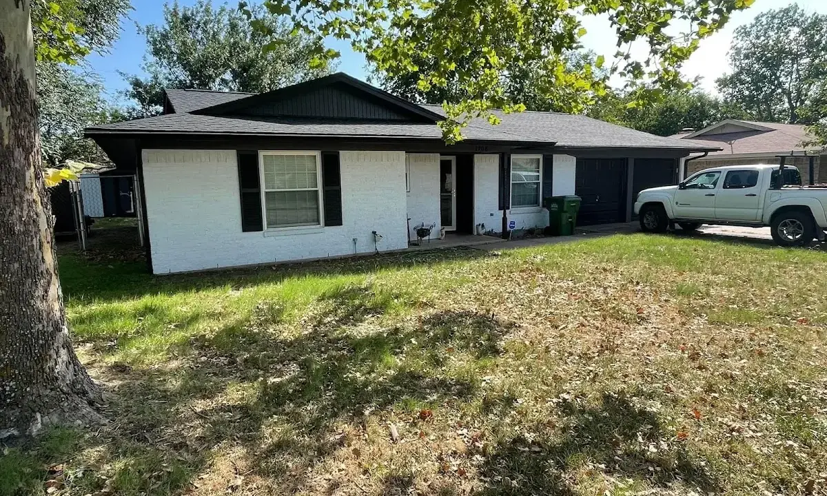 Professional roofing crew working on a residential roof in South Euclid
